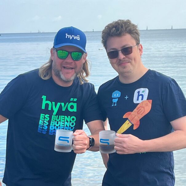 Happy Hyva Team Members with the sea in the background
